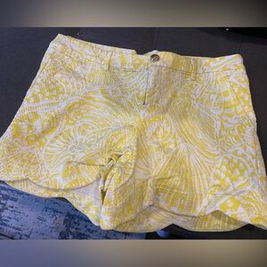 Yellow scallop shorts with seashell button